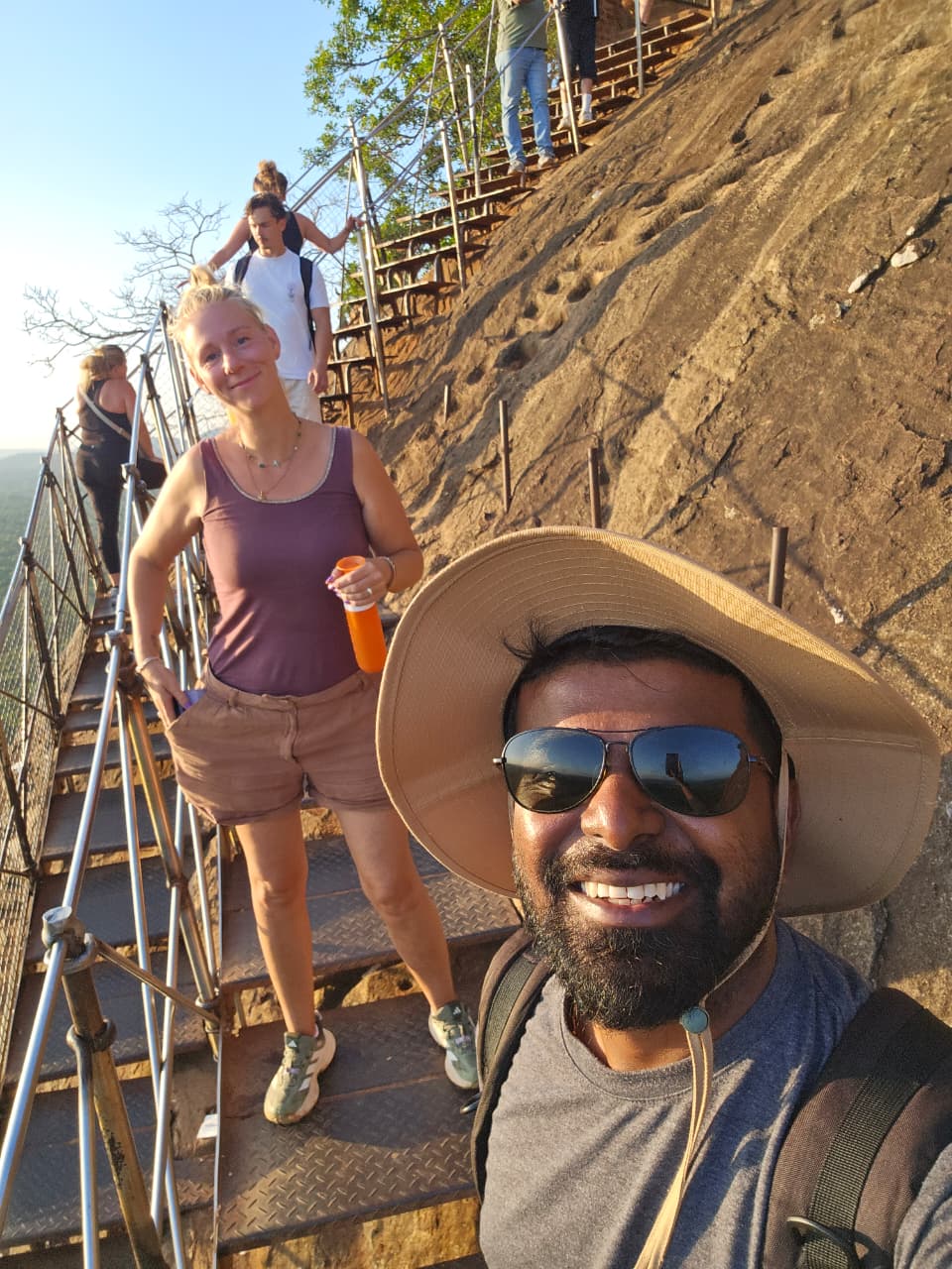 Climbing the final staircase up Sigiriya Rock