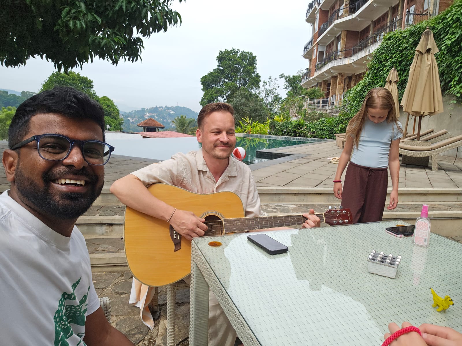 Evening guitar session by the pool in the hills above Kandy