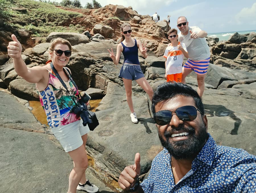Guests celebrating on a dramatic stretch of coastline