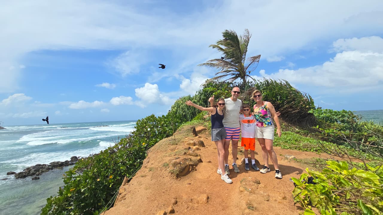 The family together on the south coast cliffs by the ocean