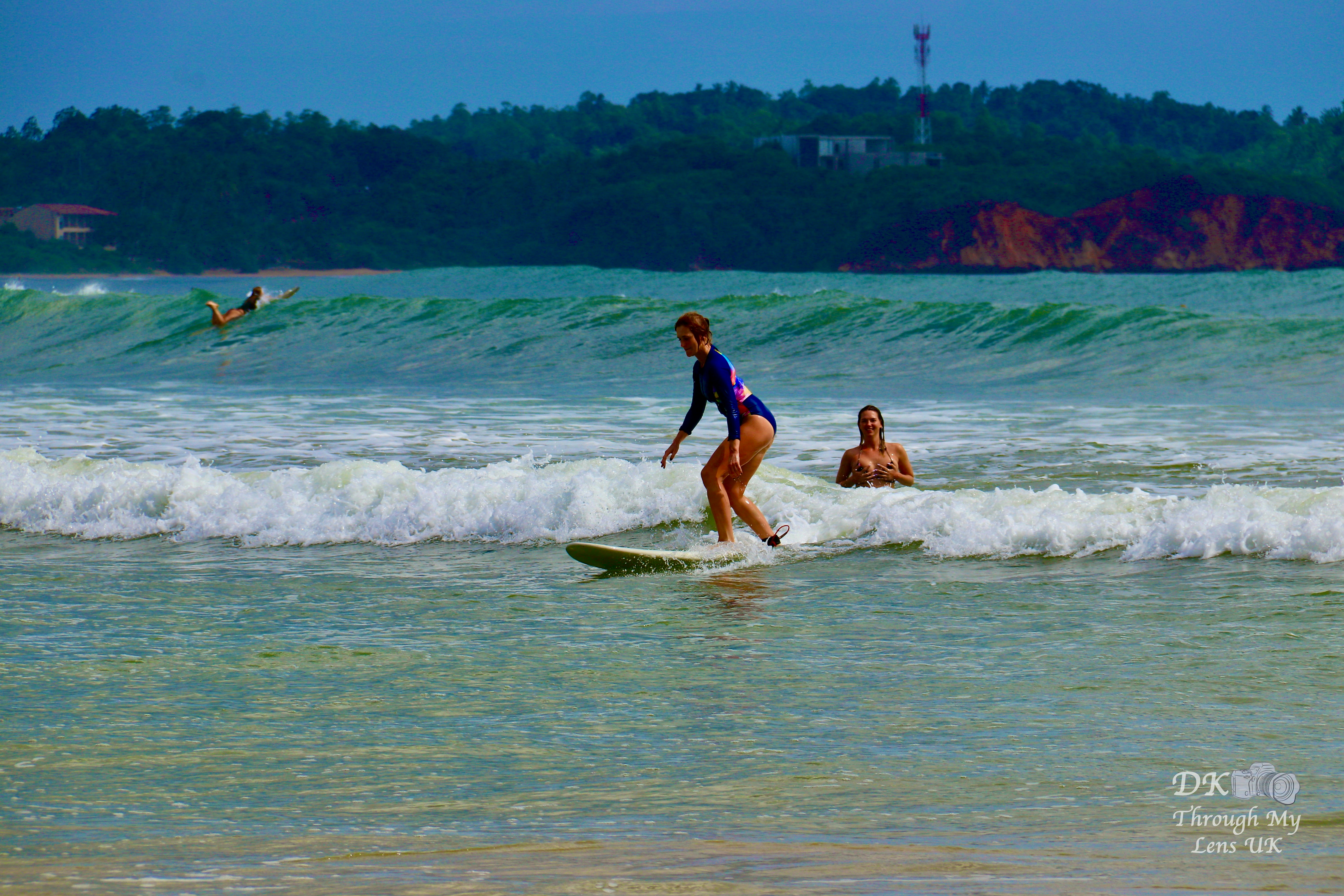 Surfer carving a clean wave on a Sri Lankan beach